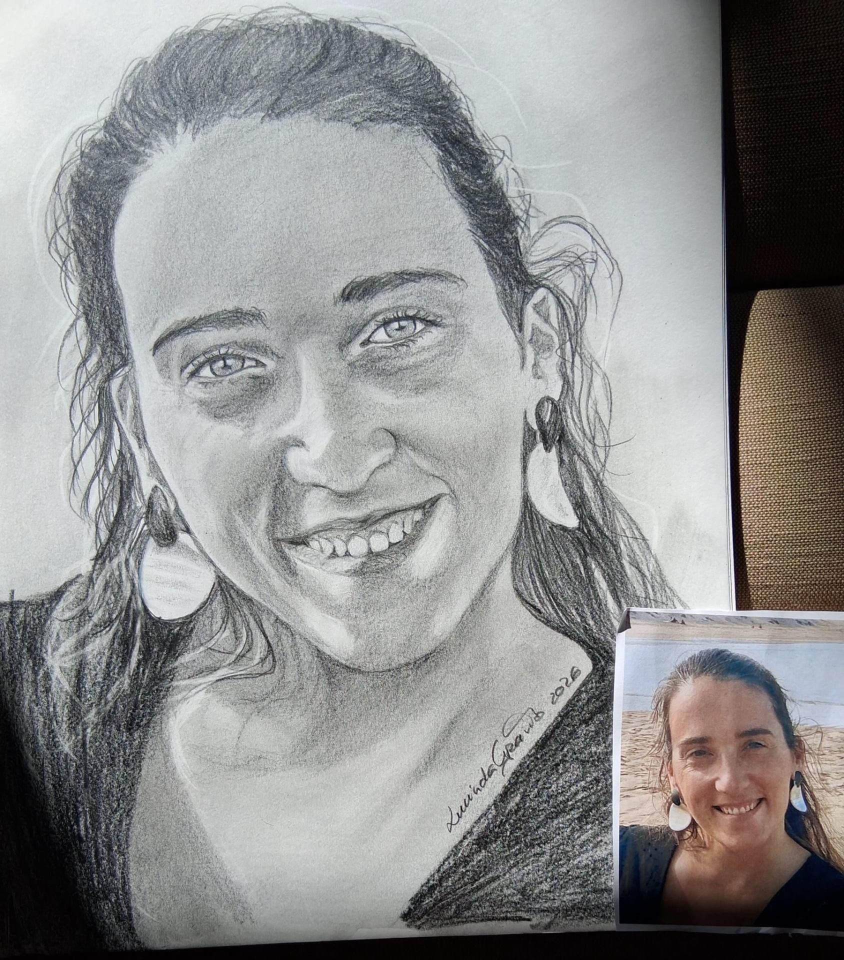 Charcoal portrait of a smiling woman